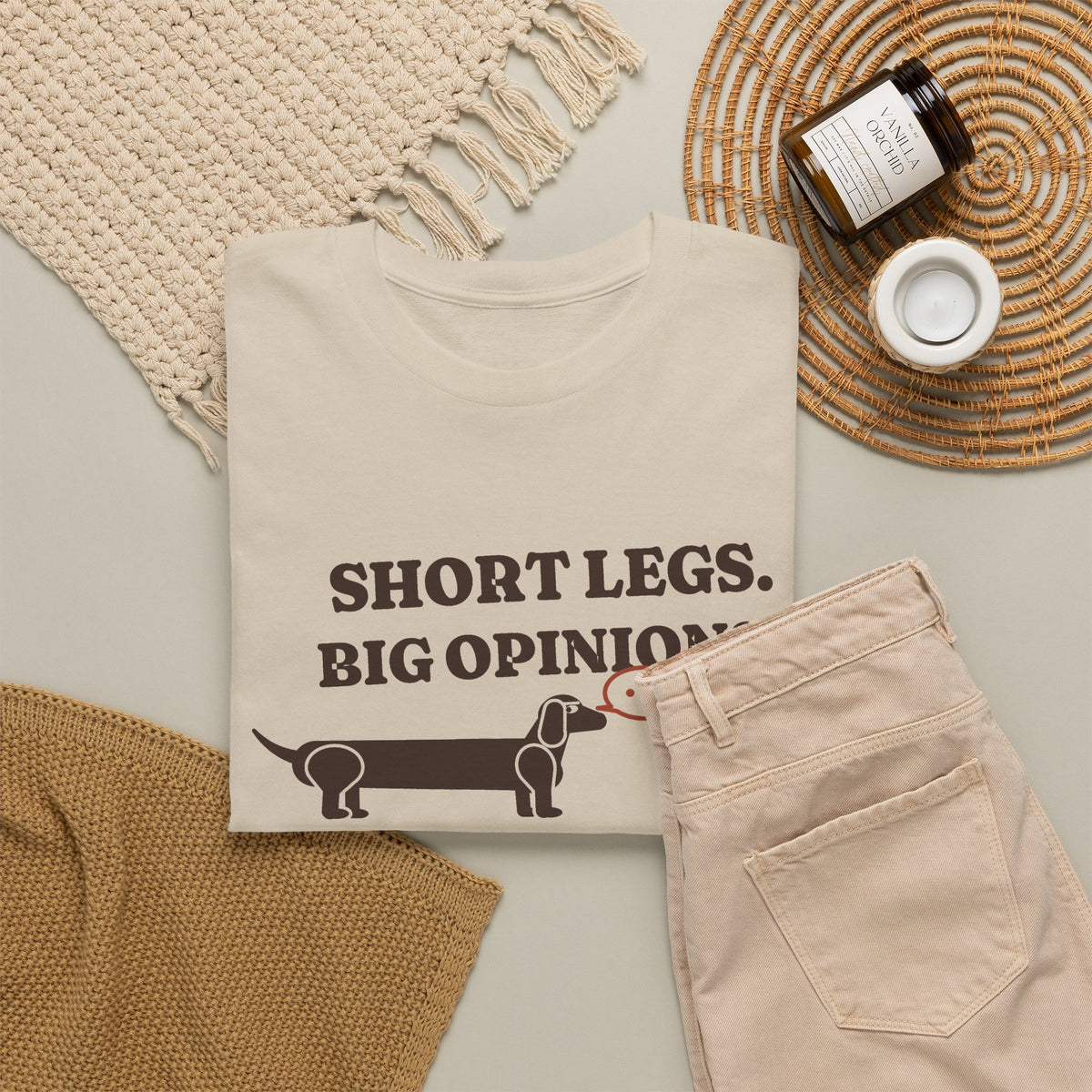 Short Legs, Big Opinions funny dachshund t-shirt in Sand, flat lay