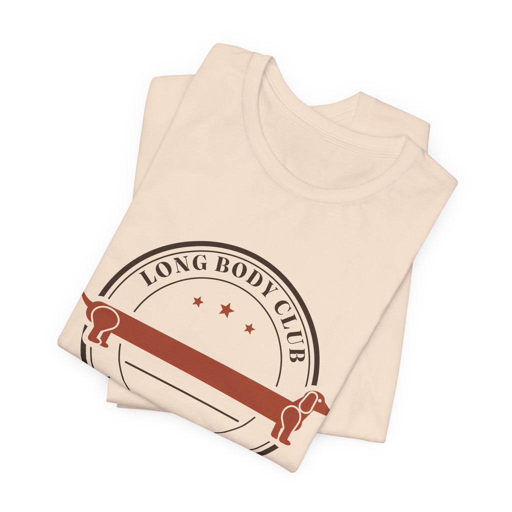 Long Body Club retro badge dachshund t-shirt in Soft Cream, folded