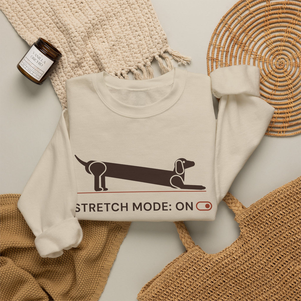 Stretch Mode On funny dachshund crewneck sweatshirt in Sand, flat lay